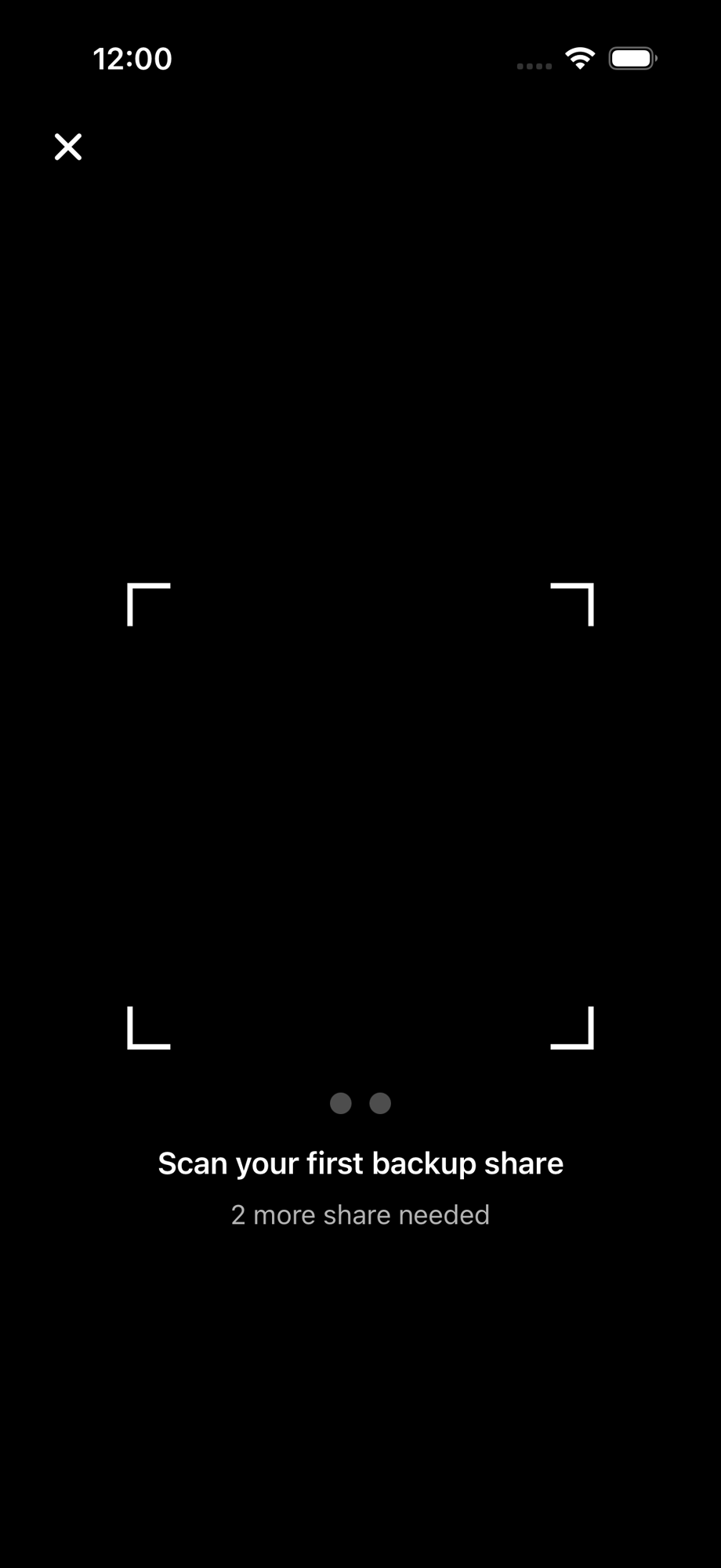 Camera QR scanner with progress dots showing one of two shares scanned